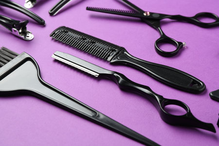Different hairdresser's tools on violet background, closeupの写真素材