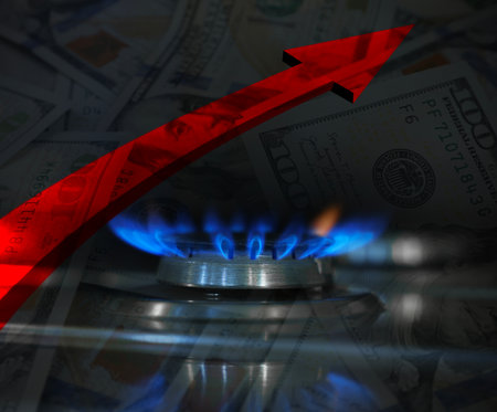 Gas burner with blue flame, red arrow and dollar bills, double exposure. Gas price increaseの写真素材