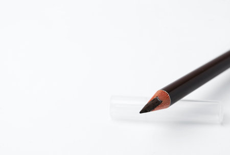 Brown eyebrow pencil on white background, closeup. Space for textの写真素材