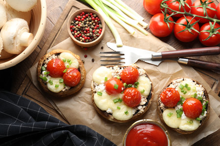 Tasty stuffed mushrooms served on wooden table, flat layの写真素材