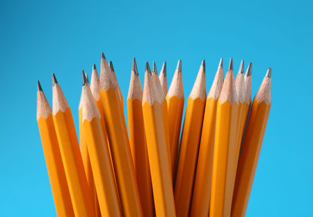 Sharp graphite pencils on light blue background, closeupの写真素材