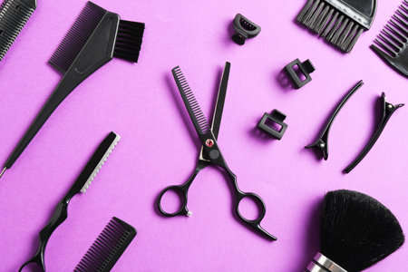Different hairdresser's tools on violet background, flat layの写真素材