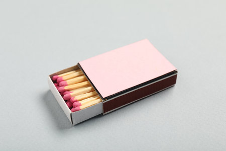 Matches in box on grey background, closeup. Mockup for designの写真素材