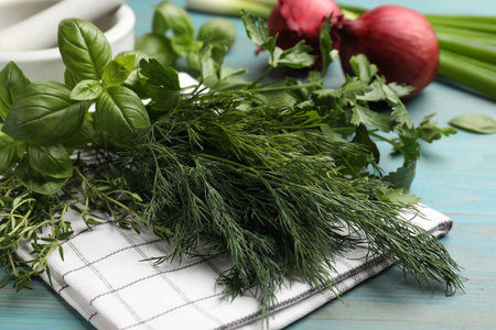 Different herbs and spices on blue wooden table, closeupの写真素材