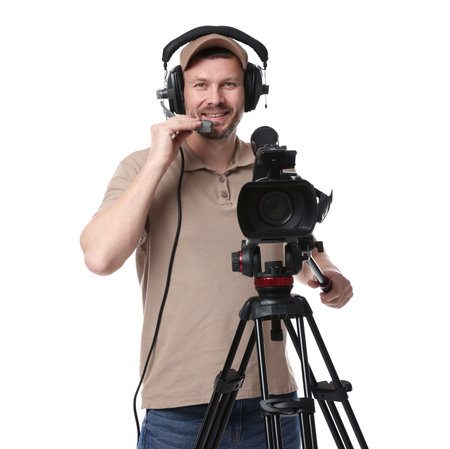 Man with professional video camera and headset on white background