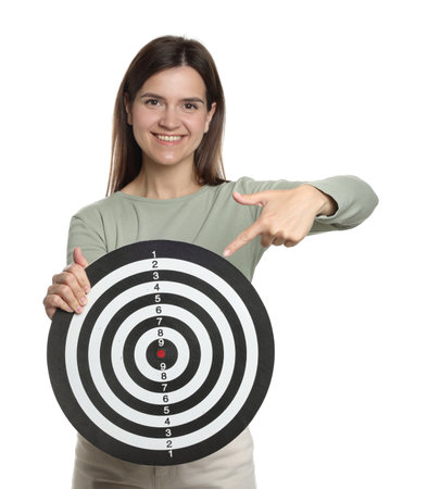 Targeting. Smiling woman pointing at dart board on white backgroundの写真素材
