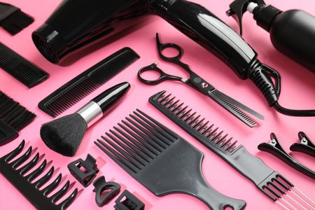 Different hairdresser's tools on pink background, above viewの写真素材