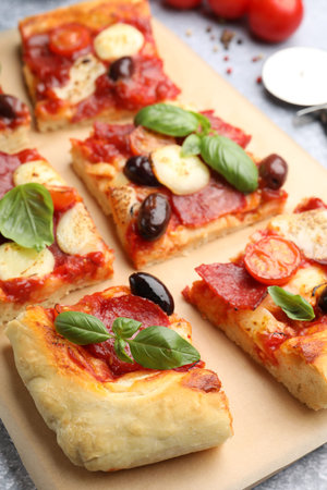 Pieces of tasty homemade pizza on table, closeupの写真素材