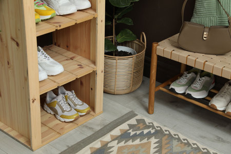 Different footwear on shelves in entryway. Shoe storageの写真素材