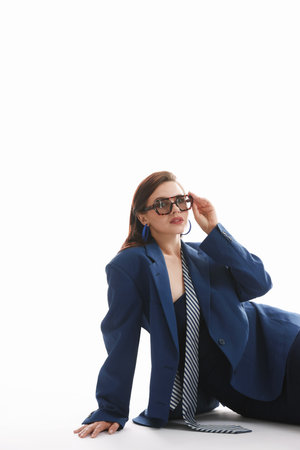 Young woman in stylish clothes on white backgroundの写真素材