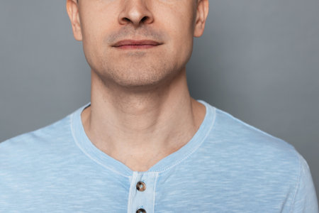 Man after shaving on grey background, closeupの写真素材