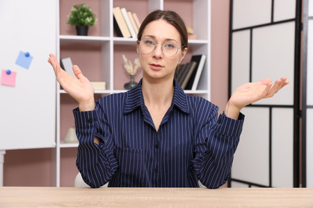 Online speaker streaming webinar at table indoors, view from web cameraの写真素材