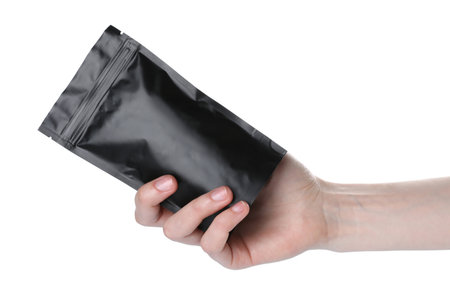 Woman with zipper stand-up pouch on white background, closeup. Mockup for designの写真素材