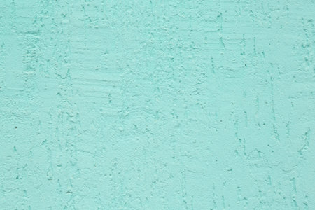 Turquoise cement textured surface as background, closeup
