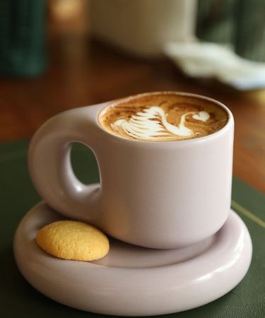 Aromatic coffee in cup and cookie on table, closeupの写真素材