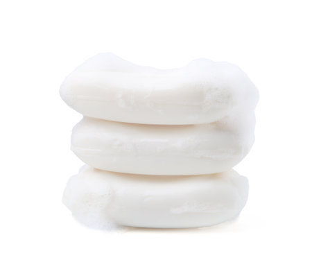 Soap bars with foam isolated on whiteの写真素材