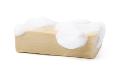 Soap bar with foam isolated on whiteの写真素材