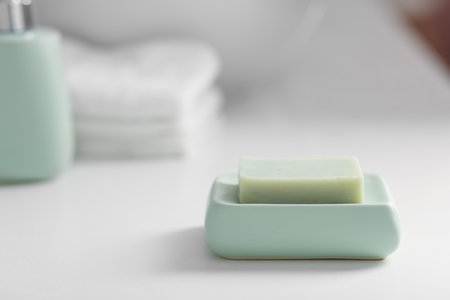One soap bar on white table, closeup. Space for textの写真素材