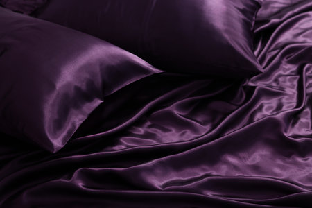 Luxury purple silk bed linens as background, closeupの写真素材