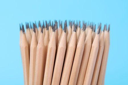 Many graphite pencils on light blue background, closeupの写真素材