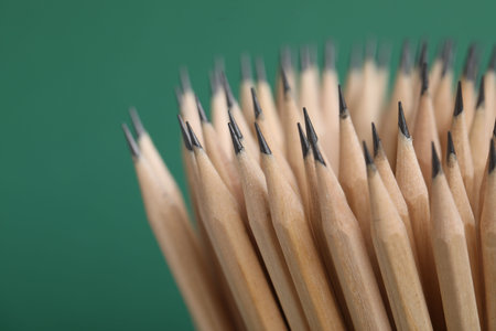 Many graphite pencils on green background, closeupの写真素材