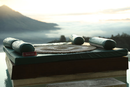 Empty couch with picturesque view of mountainsの写真素材