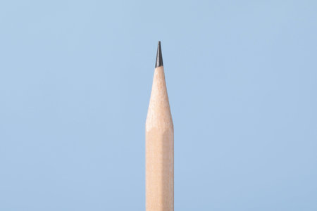 One graphite pencil on grey background, closeup
