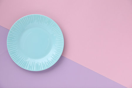 Empty plate on color background, top view. Space for textの写真素材
