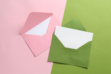 Blank invitation cards and envelopes on color background, flat layの写真素材