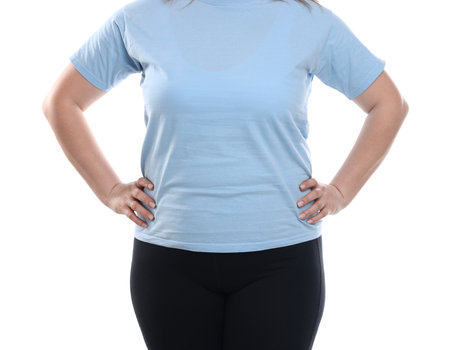 Weight loss. Plus size woman on white background, closeupの写真素材