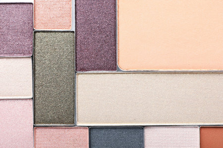 Beautiful eye shadow refill pans as background, top view