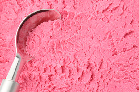 Tasty strawberry sorbet and spoon as background, top viewの写真素材