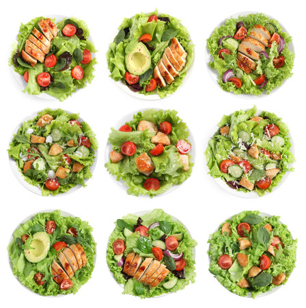 Tasty fresh salads with meat on white background, set. Top viewの写真素材