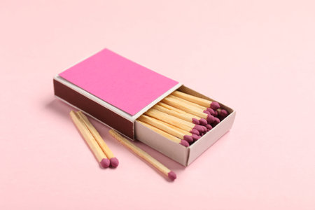 Matches and box on pink background, closeupの写真素材