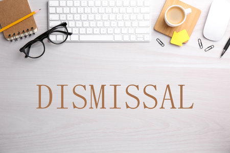 Word Dismissal, stationery, eyeglasses, computer keyboard and mouse on white wooden table, top viewの写真素材