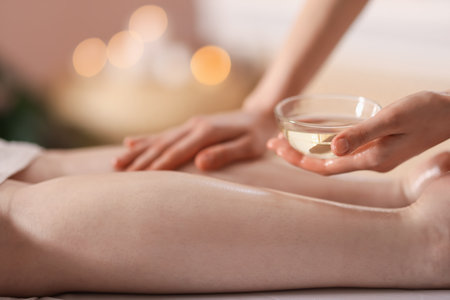 Woman receiving massage in spa salon, closeupの写真素材