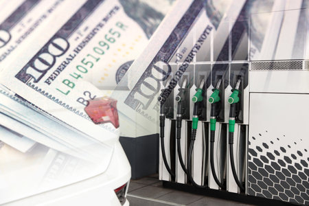 Fuel price. Gas filling station and dollar banknotes, double exposureの写真素材