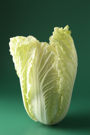 Fresh Chinese cabbage on green background, closeupの写真素材