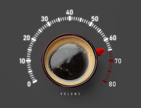 Coffee and volume of energy gauge scale on grey background, top view. Handle of cup pointing at maximum area. Stimulating property of caffeineの写真素材