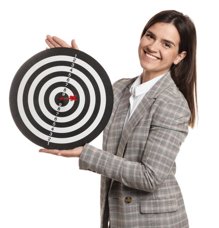 Targeting. Smiling businesswoman with dart board on white backgroundの写真素材
