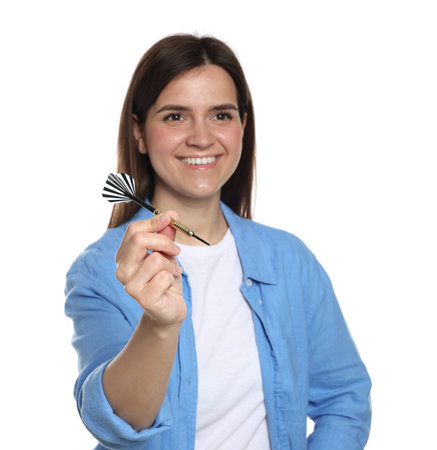 Targeting. Smiling woman with dart on white background