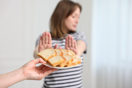 Gluten free diet. Woman refusing from bread indoors, selective focusの写真素材