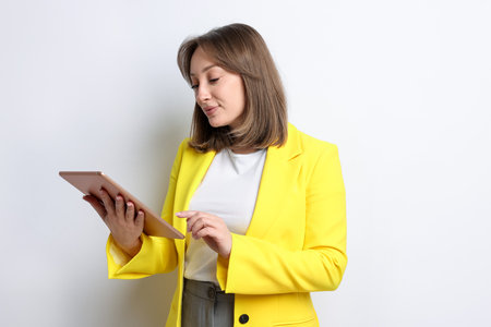 Woman with modern tablet on white backgroundの写真素材