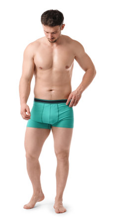 Young man in stylish turquoise underwear on white backgroundの写真素材