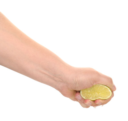 Woman squeezing lime on white background, closeupの写真素材