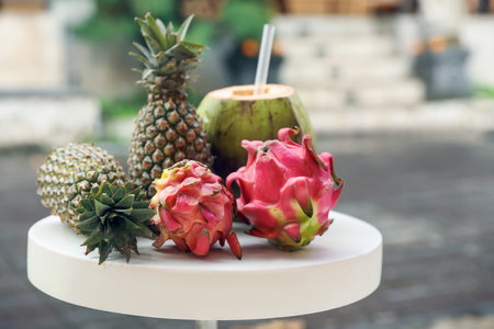 Different fresh fruits on white table outdoors, closeup. Space for text