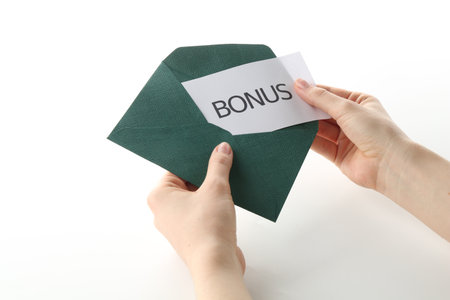 Woman holding envelope with word Bonus on white background, closeupの写真素材