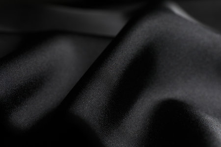 Crumpled black silk fabric as background, closeupの写真素材
