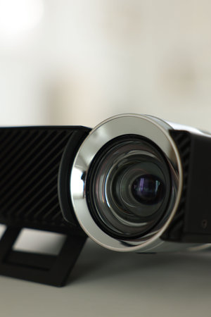 Modern video projector on white table indoors, closeupの写真素材