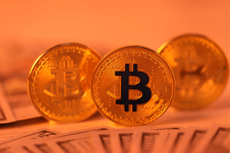 Cryptocurrency. Bitcoins and dollar banknotes on table, closeup
